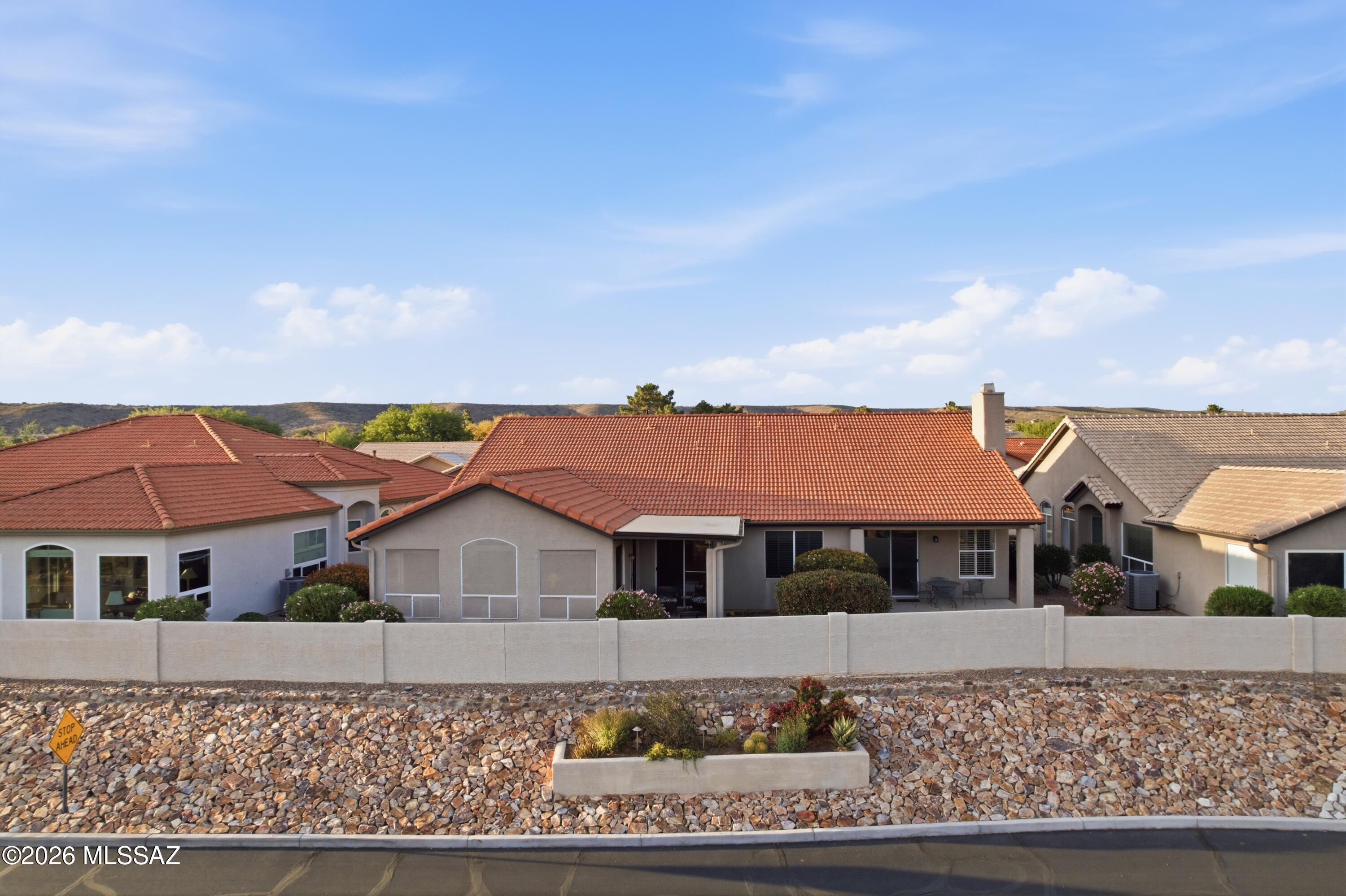 64351 East Wind Ridge Circle Tucson, AZ 85739 - Photo 36 of 41 front view of a house with a porch