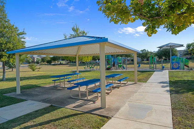 a view of swimming pool with sitting area and furniture