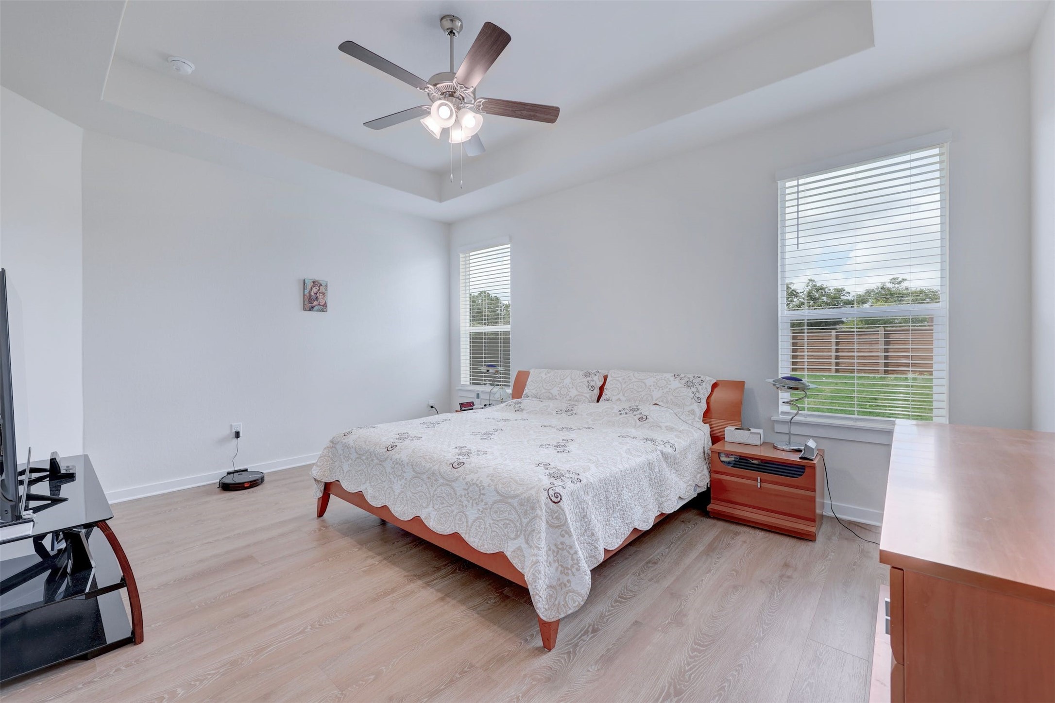2041 Centerline Lane Georgetown, TX 78628 - Photo 17 of 31 a bedroom with a bed and a chandelier
