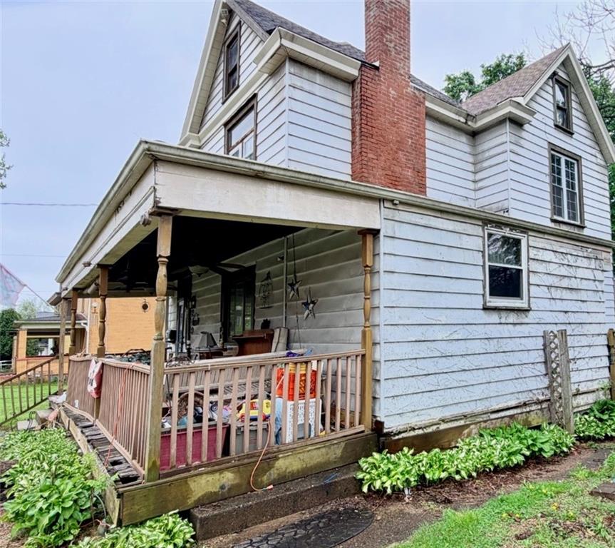 249 Freeport Road New Kensington, PA 15068 - Photo 3 of 11 a view of a house with wooden fence