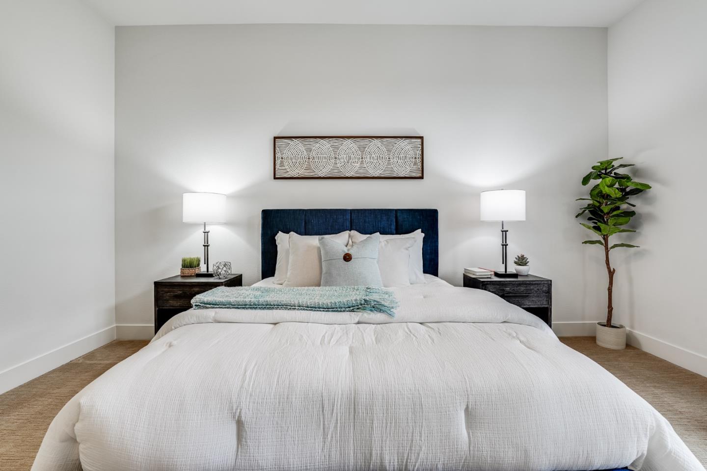 465 Landeros Drive San Mateo, CA 94403 - Photo 18 of 36 a bedroom with a bed and a potted plant