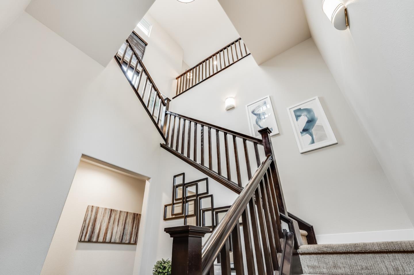 465 Landeros Drive San Mateo, CA 94403 - Photo 24 of 36 a view of staircase with wooden floor and white walls