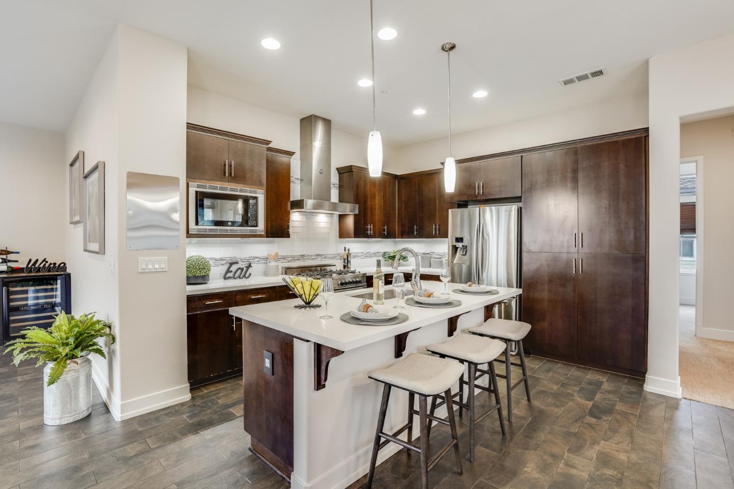 465 Landeros Drive San Mateo, CA 94403 - Photo 5 of 36 a kitchen with refrigerator and chairs