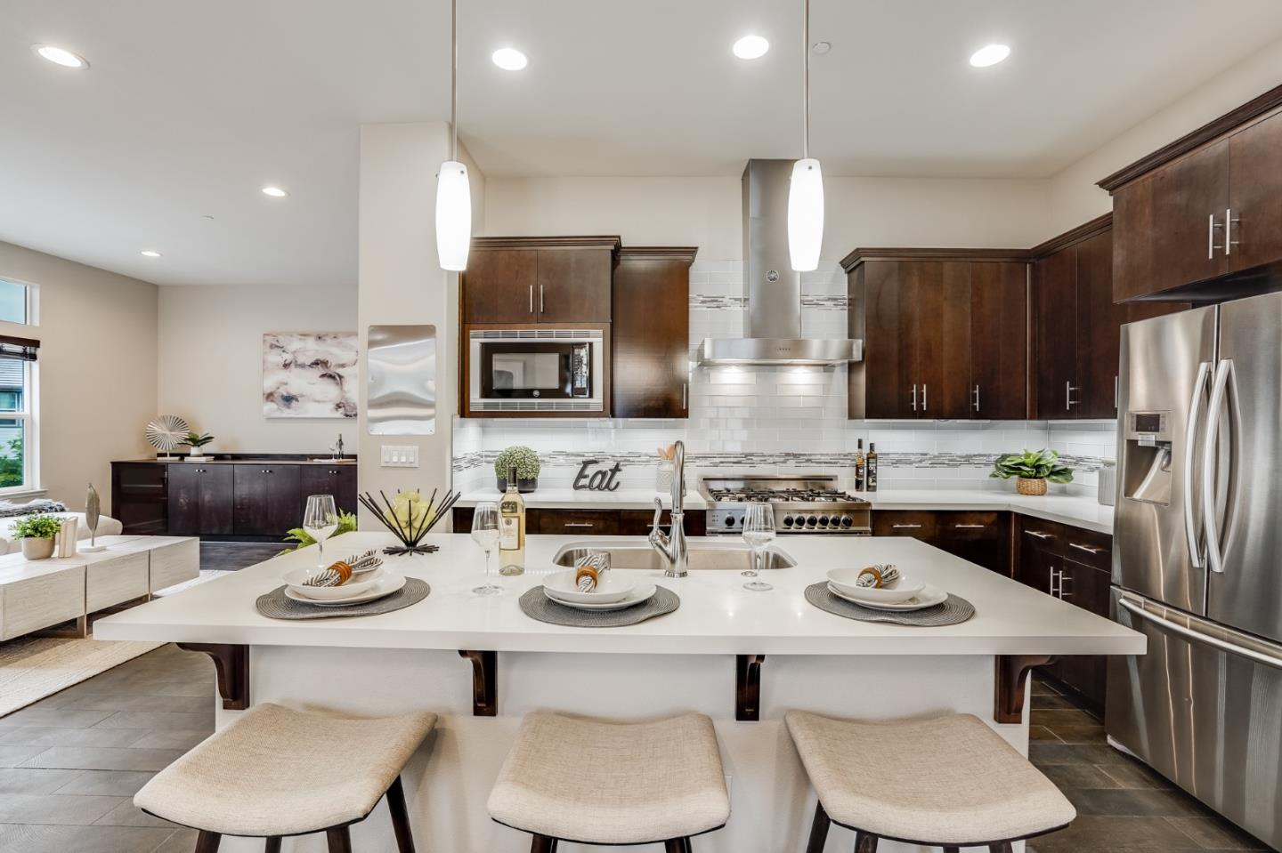 465 Landeros Drive San Mateo, CA 94403 - Photo 7 of 36 a kitchen with a sink a stove and chairs