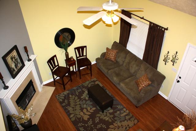 7218 Blue Ridge Drive Fairview, TN 37062 - Photo 5 of 20 Vaulted ceiling and gas log fireplace in the living room. New laminate flooring throughout main level.