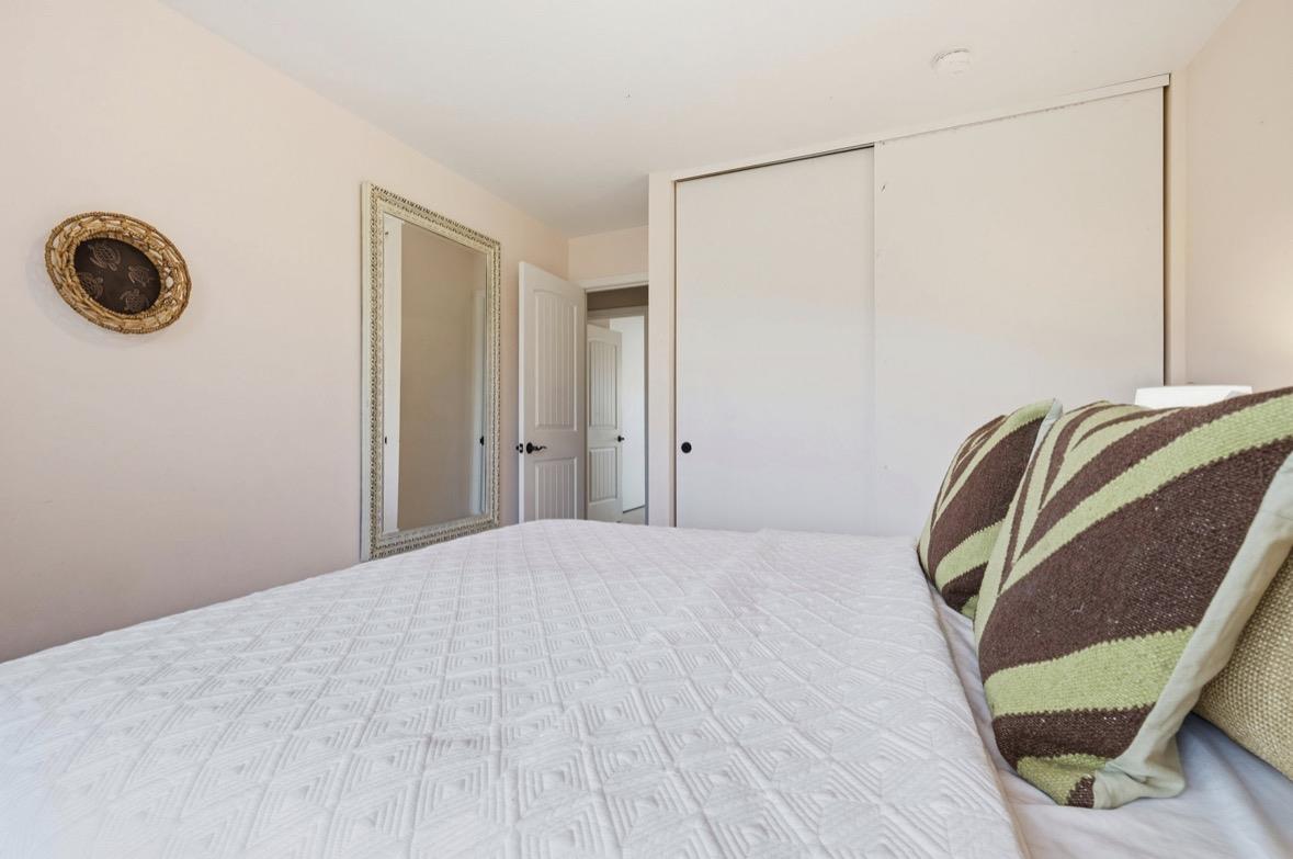 229 Rio Del Mar Boulevard Aptos, CA 95003 - Photo 16 of 27 a bedroom with a bed and a window