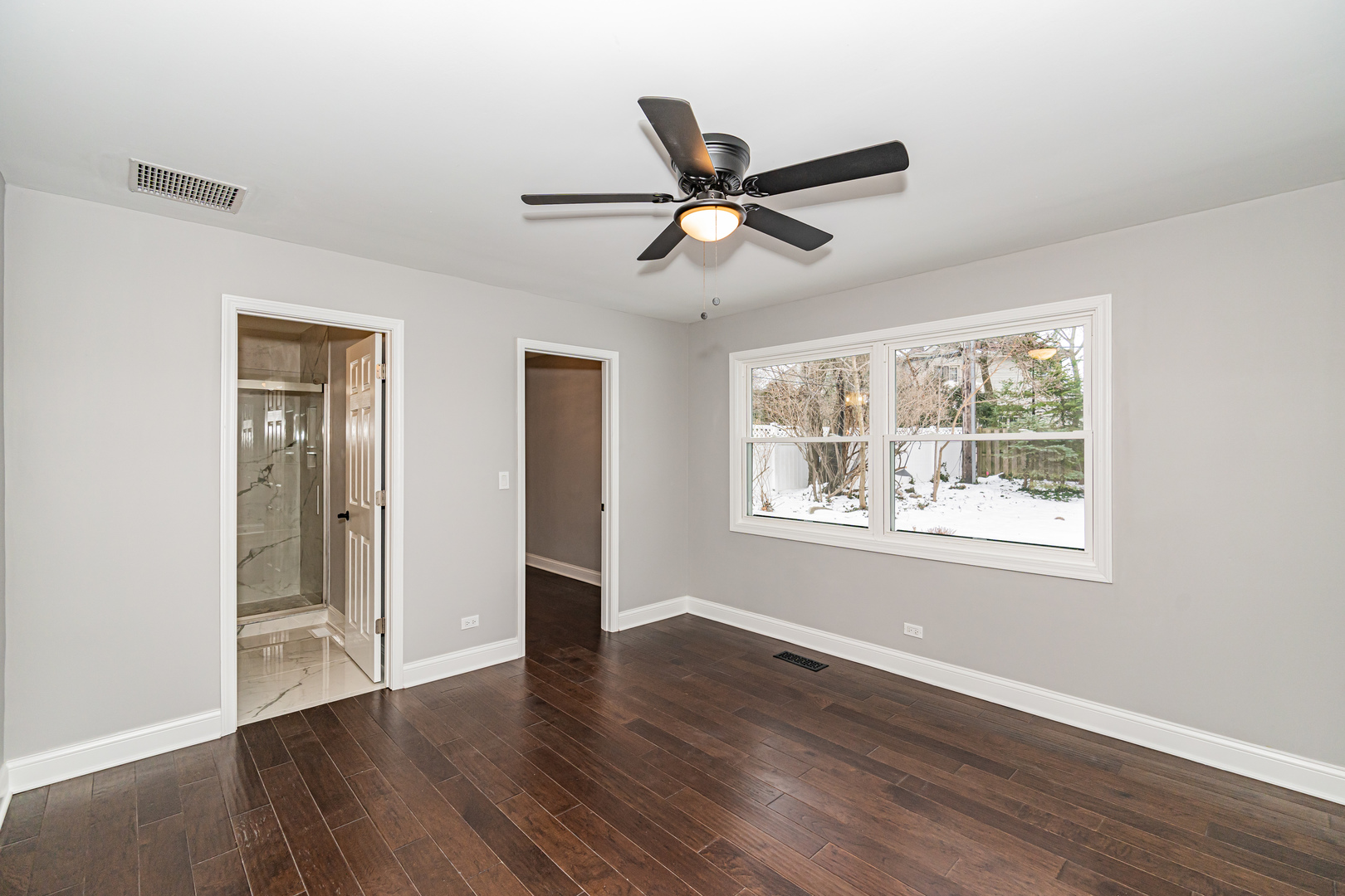 1913 Martingale Road Wheaton, IL 60187 - Photo 14 of 36 a view of an empty room with wooden floor and a window