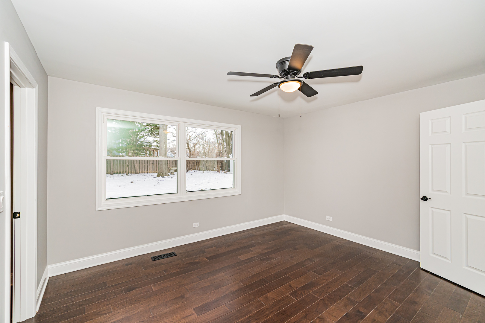 1913 Martingale Road Wheaton, IL 60187 - Photo 15 of 36 an empty room with wooden floor fan and windows