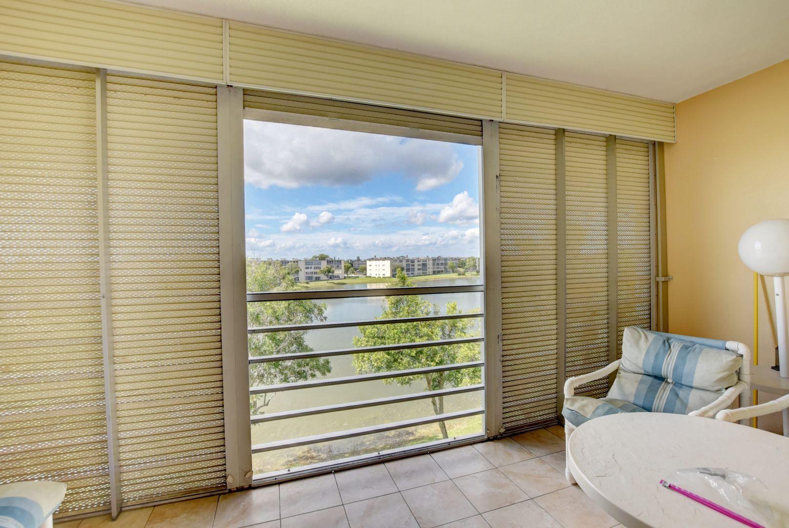 4015 Rexford Drive, Unit 4015 Boca Raton, FL 33434 - Photo 16 of 29 Screened Patio w/Pull Downs
