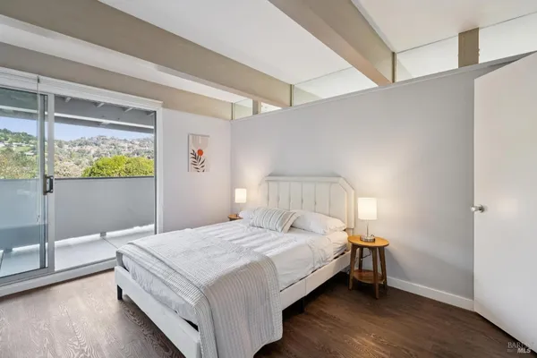 a bedroom with a bed and a view of bedroom