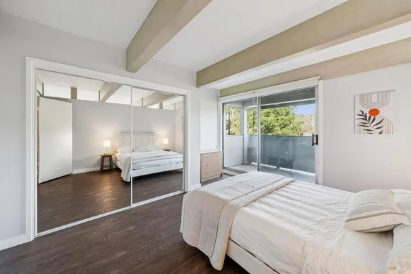 a bedroom with a bed and a lamp