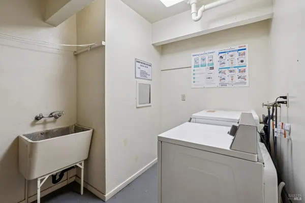 a view of closet with wooden floor
