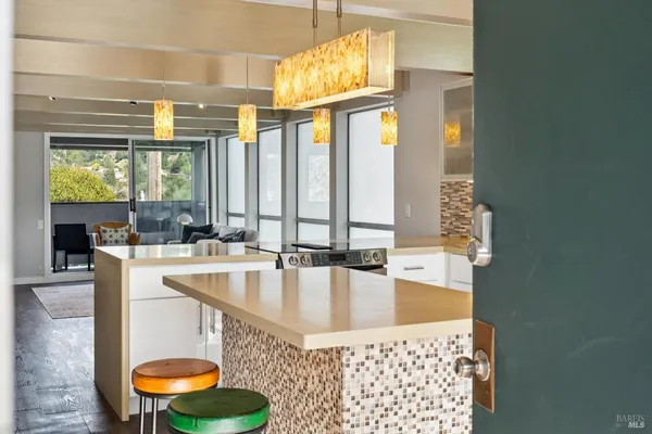 a kitchen with stainless steel appliances granite countertop a sink a refrigerator and a stove