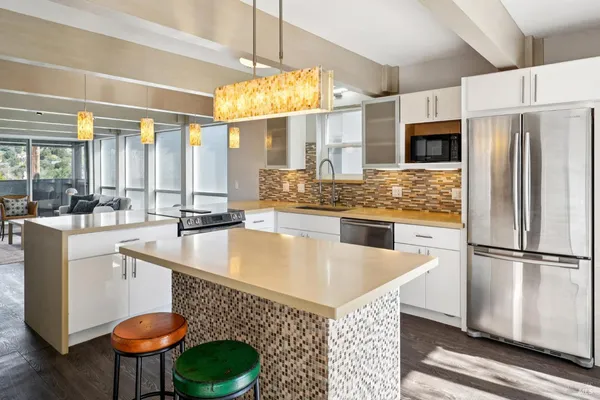 a kitchen with a stove and a sink