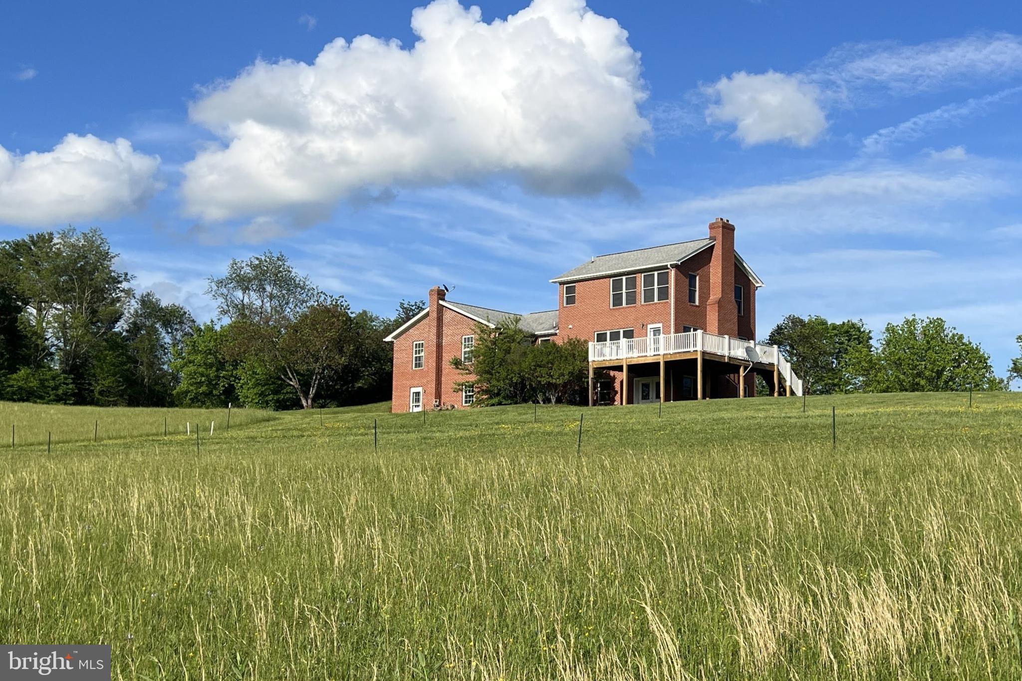 3542 Slate Mills Road Sperryville, VA 22740 - Photo 3 of 31 West side of the home with large deck