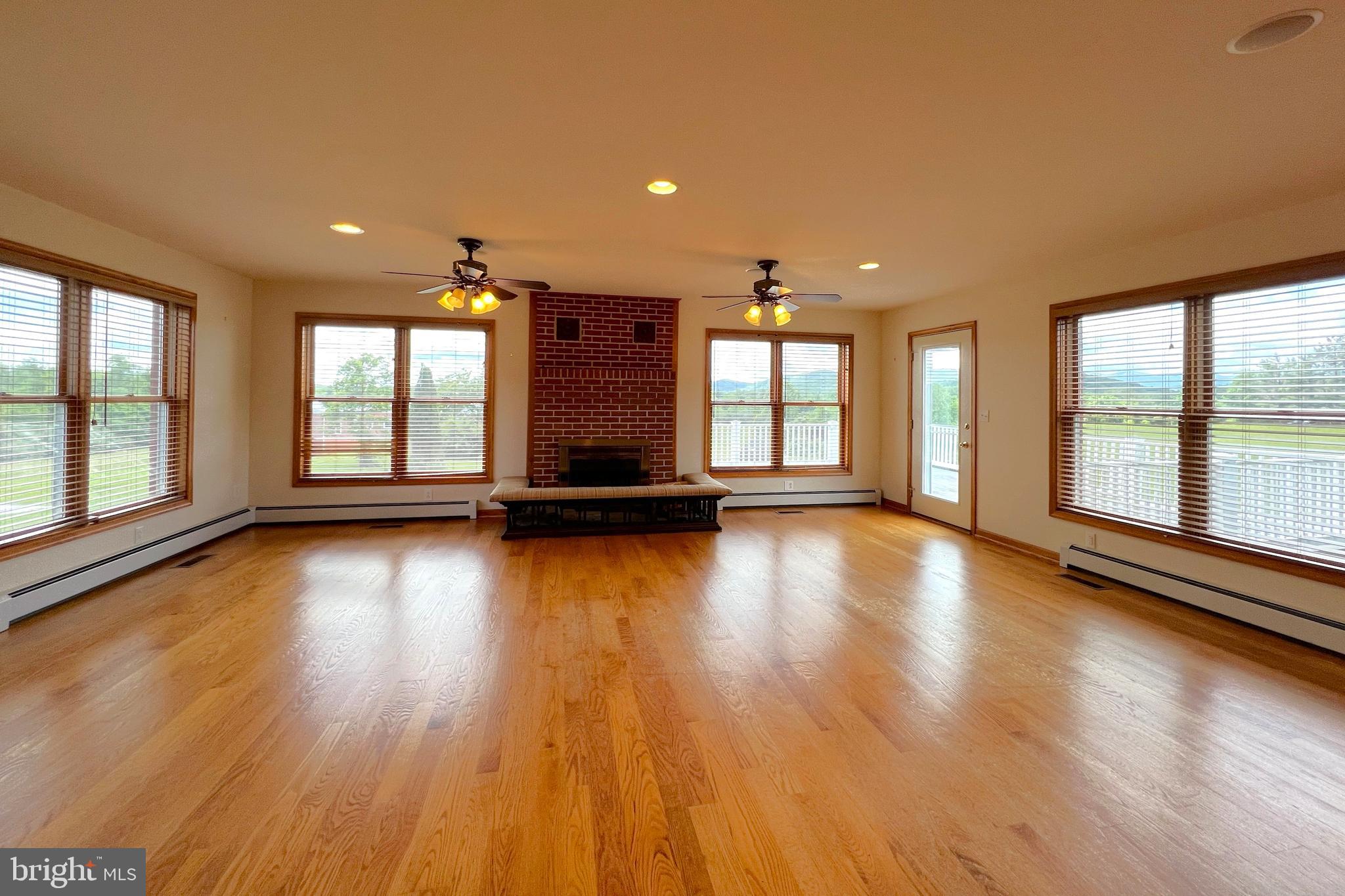 3542 Slate Mills Road Sperryville, VA 22740 - Photo 6 of 31 Great room with fireplace and classic fender