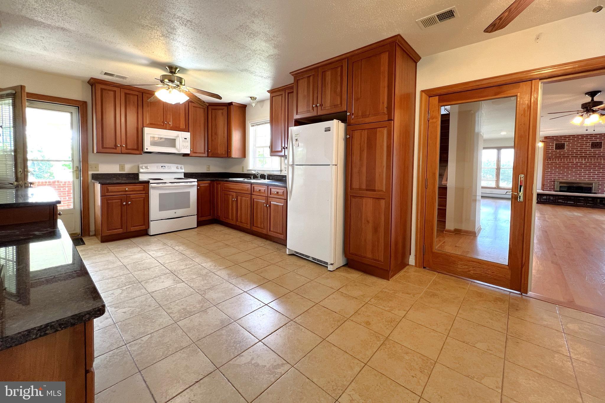 3542 Slate Mills Road Sperryville, VA 22740 - Photo 9 of 31 Kitchen with cherry cabinets and granite counters