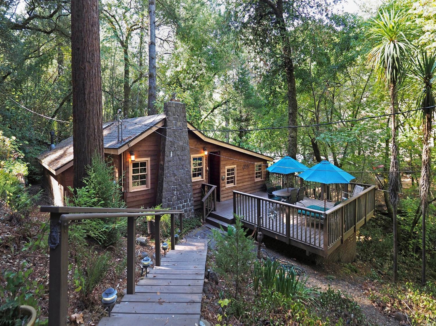 3170 Calistoga Road Santa Rosa, CA 95404 - Photo 1 of 1 a view of a house with brick walls and wooden fence