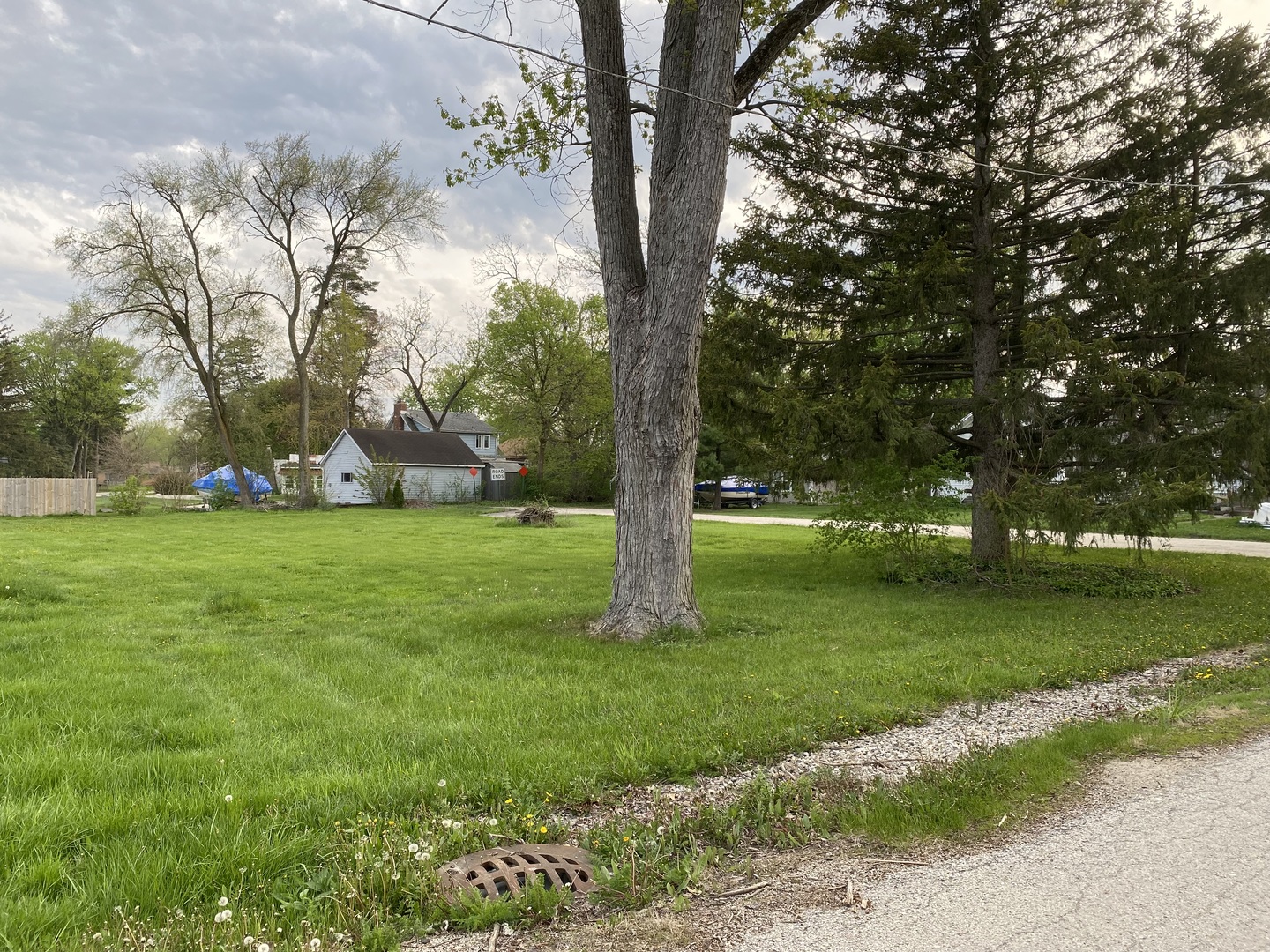 25063 3rd Antioch, IL 60002 - Photo 6 of 9 a garden with trees in front of it
