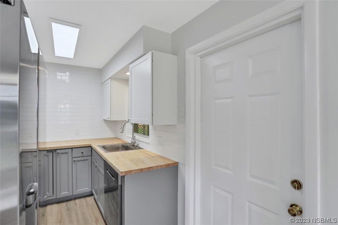 436 Palmetto Street Edgewater, FL 32132 - Photo 14 of 36 a bathroom with a sink and a mirror