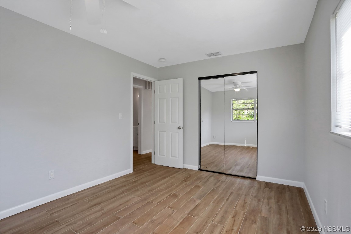 436 Palmetto Street Edgewater, FL 32132 - Photo 16 of 36 a view of livingroom with hardwood floor and a window