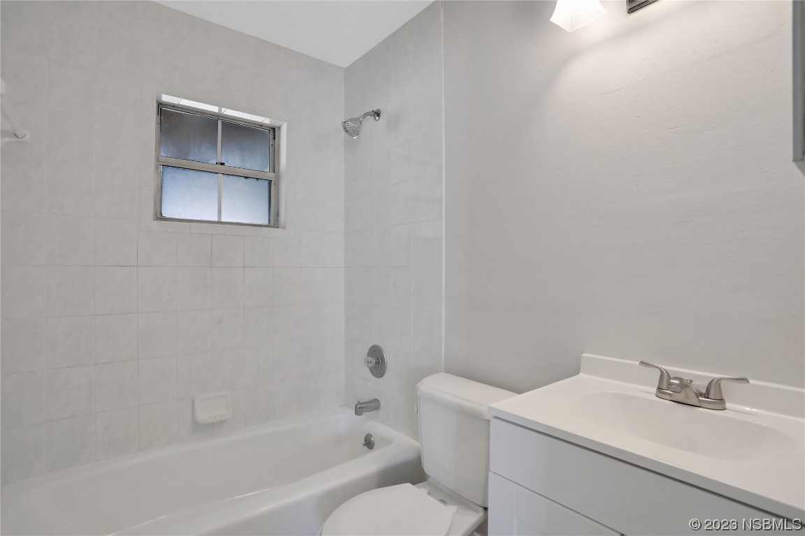 436 Palmetto Street Edgewater, FL 32132 - Photo 19 of 36 a bathroom with a sink and a toilet