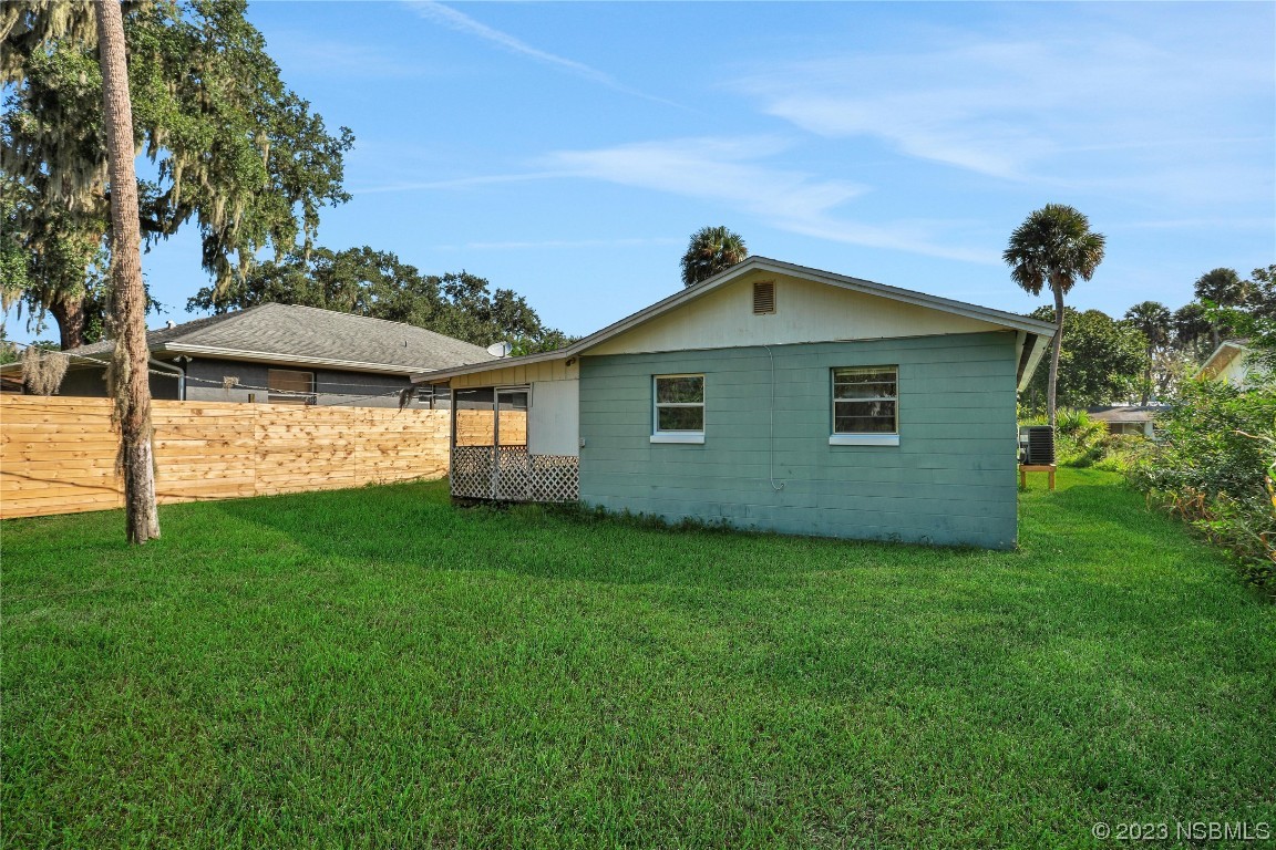 436 Palmetto Street Edgewater, FL 32132 - Photo 25 of 36 a view of a house with a backyard