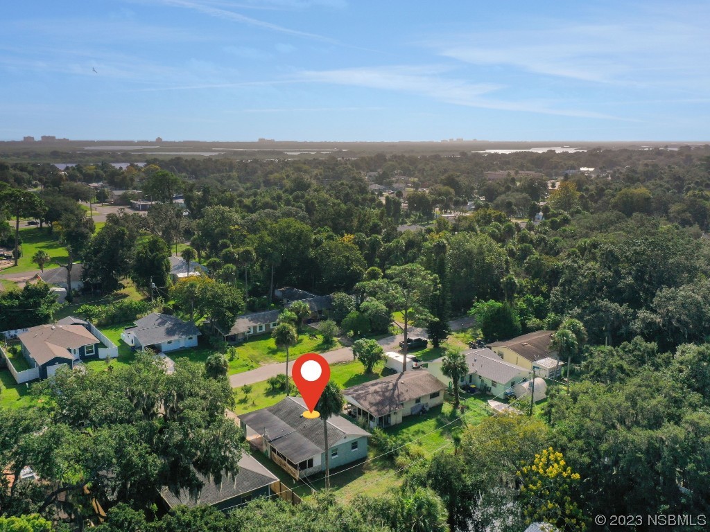 436 Palmetto Street Edgewater, FL 32132 - Photo 32 of 36 an aerial view of a house with a swimming pool and garden