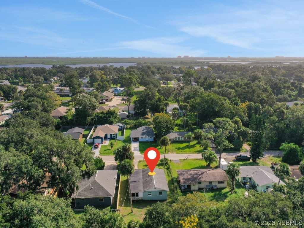 436 Palmetto Street Edgewater, FL 32132 - Photo 33 of 36 an aerial view of house with yard and mountain view in back