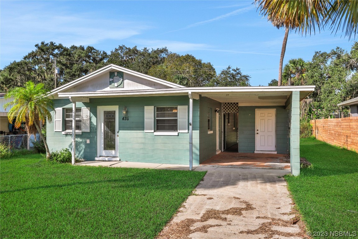 436 Palmetto Street Edgewater, FL 32132 - Photo 34 of 36 a front view of a house with a yard