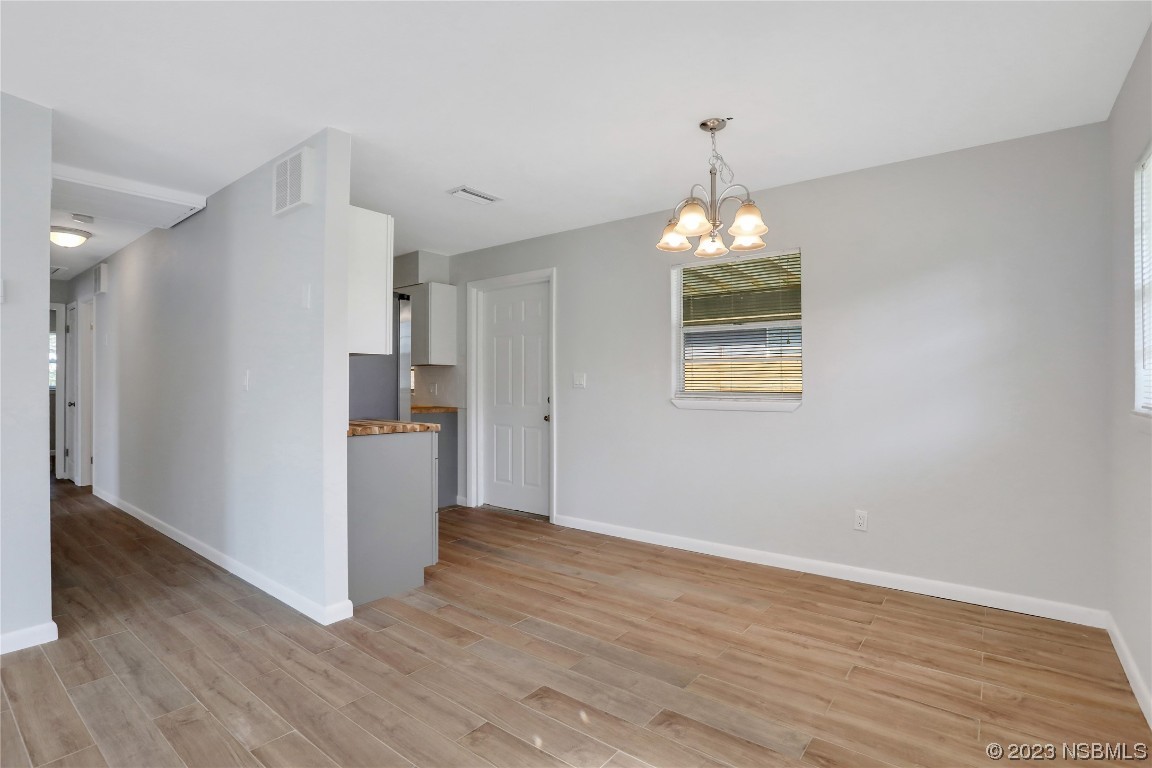 436 Palmetto Street Edgewater, FL 32132 - Photo 6 of 36 a very nice looking room with wooden floor and a window