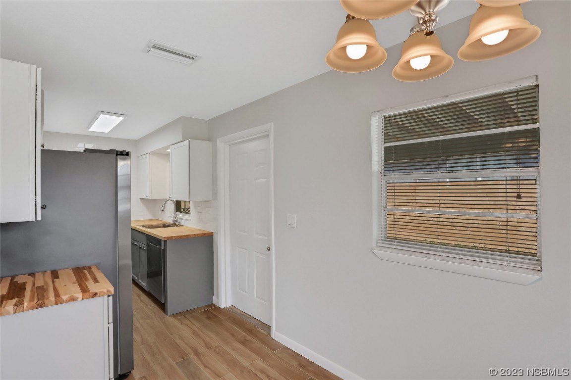436 Palmetto Street Edgewater, FL 32132 - Photo 9 of 36 a kitchen that has a sink and a stove in it