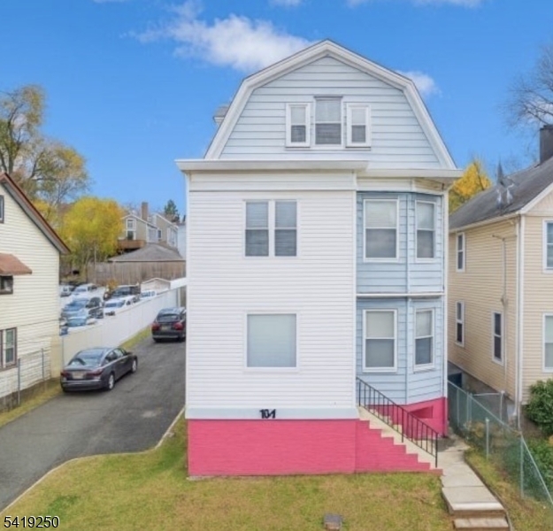 a front view of a house with yard