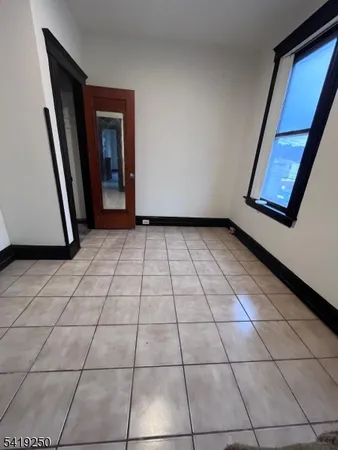 a view of a livingroom with a washer and dryer
