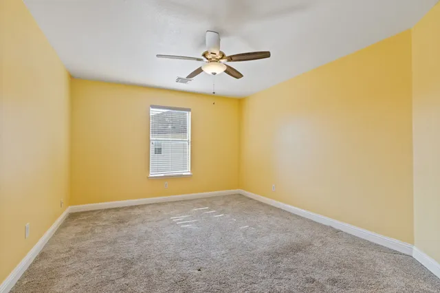 a view of a big room with windows