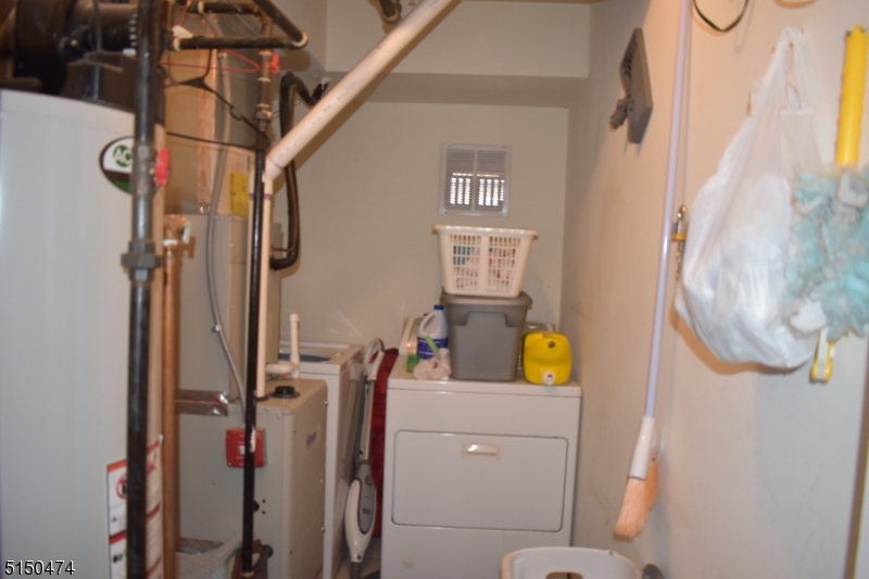 14 Hunter Street, Unit 1 Newark, NJ 07114 - Photo 6 of 9 a bathroom with a toilet sink and mirror