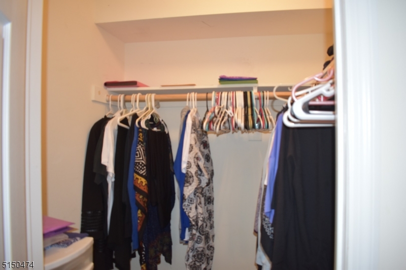 14 Hunter Street, Unit 1 Newark, NJ 07114 - Photo 9 of 9 a view of walk in closet with clothes and shoes