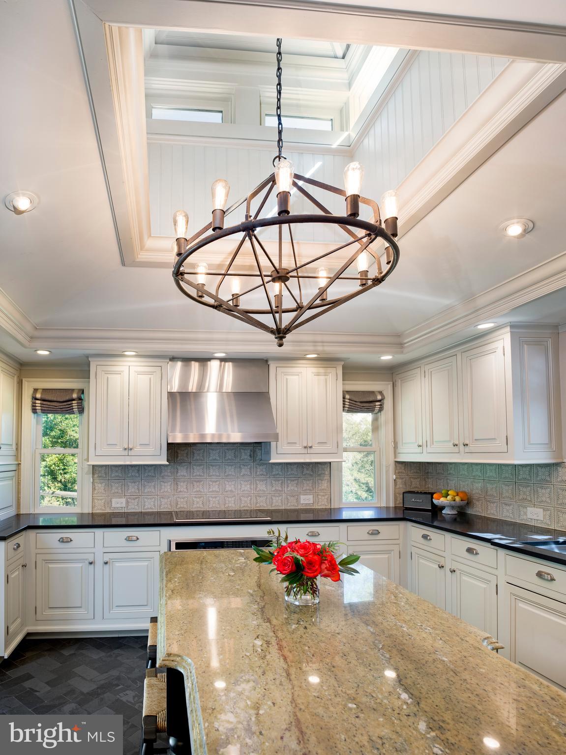 813 Hunt Road Newtown Square, PA 19073 - Photo 15 of 49 a kitchen with stainless steel appliances granite countertop a sink window and cabinets