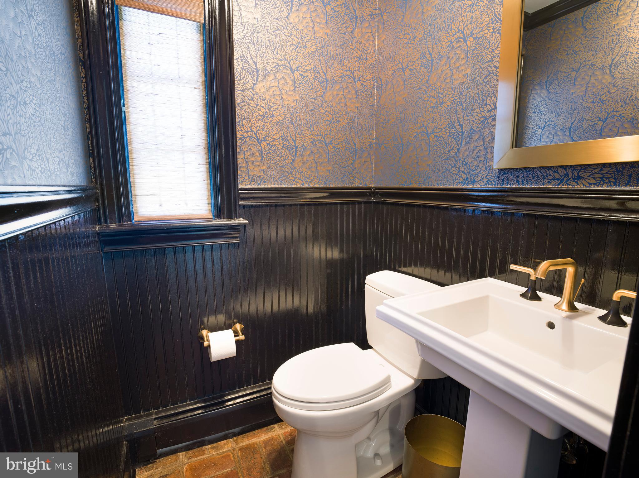 813 Hunt Road Newtown Square, PA 19073 - Photo 23 of 49 a bathroom with a sink a toilet and a window