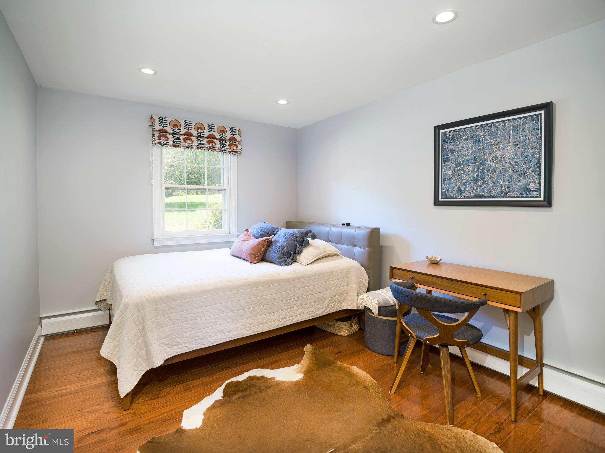813 Hunt Road Newtown Square, PA 19073 - Photo 25 of 49 a bedroom with a bed and a window