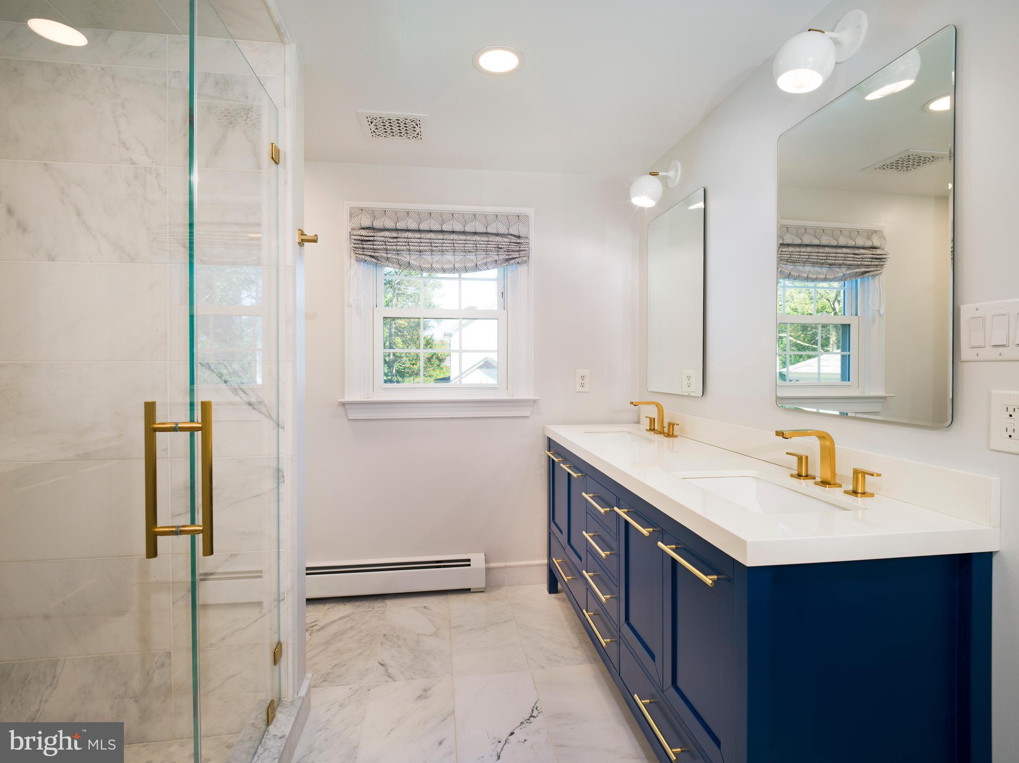 813 Hunt Road Newtown Square, PA 19073 - Photo 29 of 49 a bathroom with a sink a vanity and a mirror