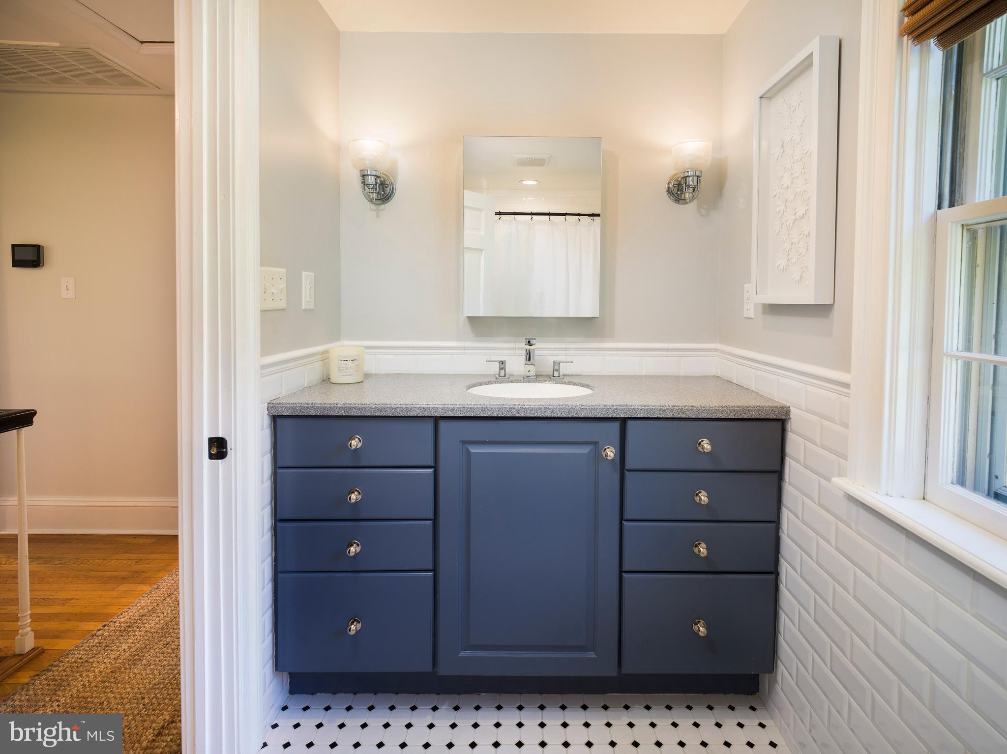 813 Hunt Road Newtown Square, PA 19073 - Photo 36 of 49 a bathroom with a granite countertop sink and a mirror