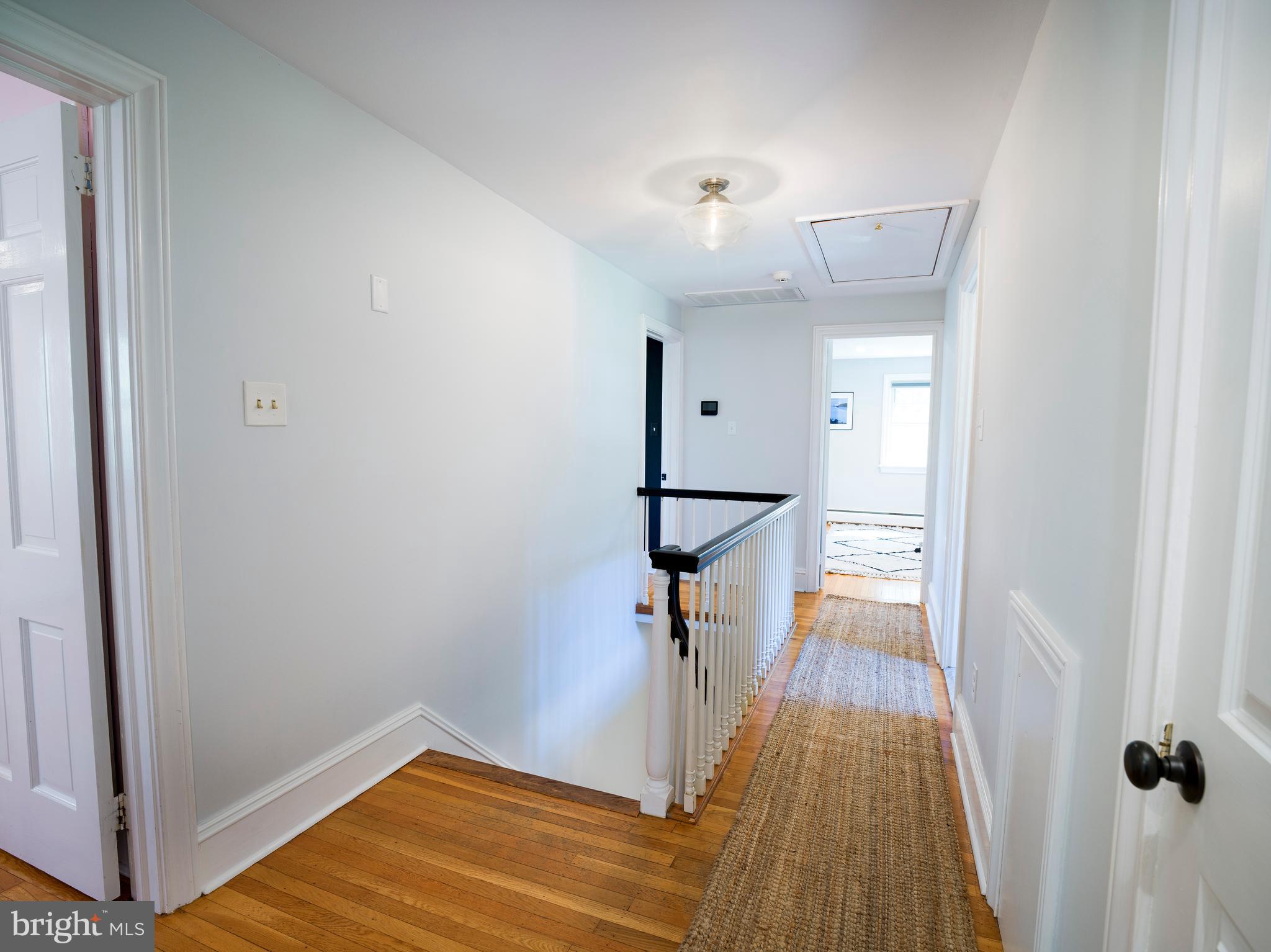 813 Hunt Road Newtown Square, PA 19073 - Photo 38 of 49 a view of a hallway with wooden floor