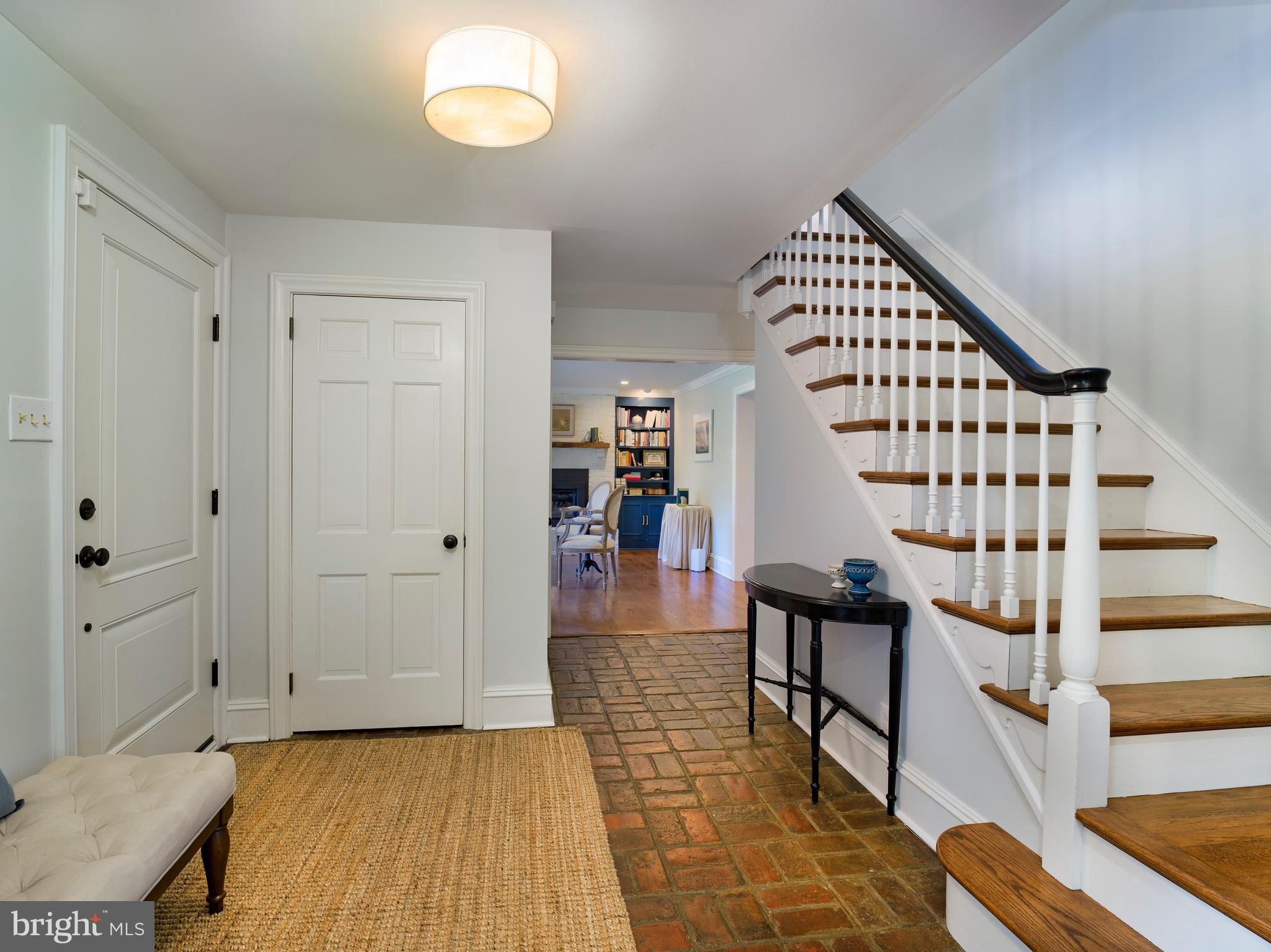 813 Hunt Road Newtown Square, PA 19073 - Photo 6 of 49 a view of a hallway with entryway wooden floor and front door