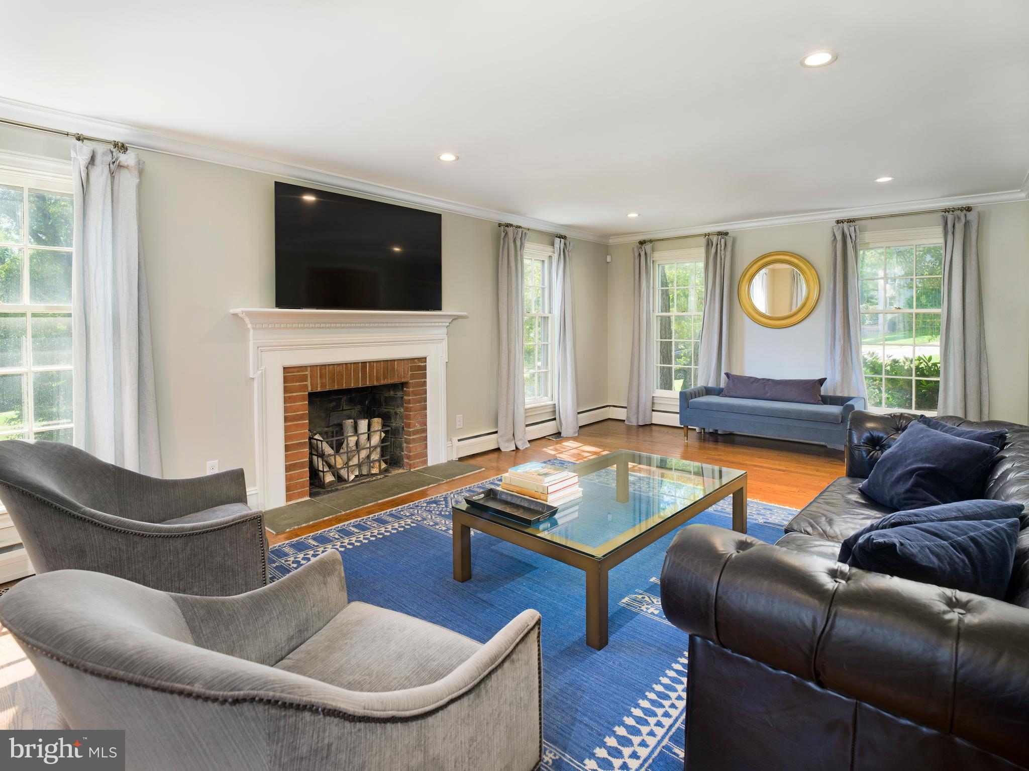 813 Hunt Road Newtown Square, PA 19073 - Photo 7 of 49 a living room with furniture and a fireplace