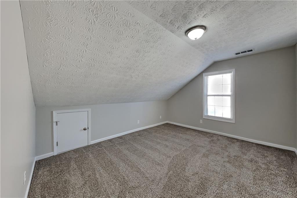 2097 Corsica Way Southwest Marietta, GA 30008 - Photo 15 of 25 an empty room with a empty space and windows