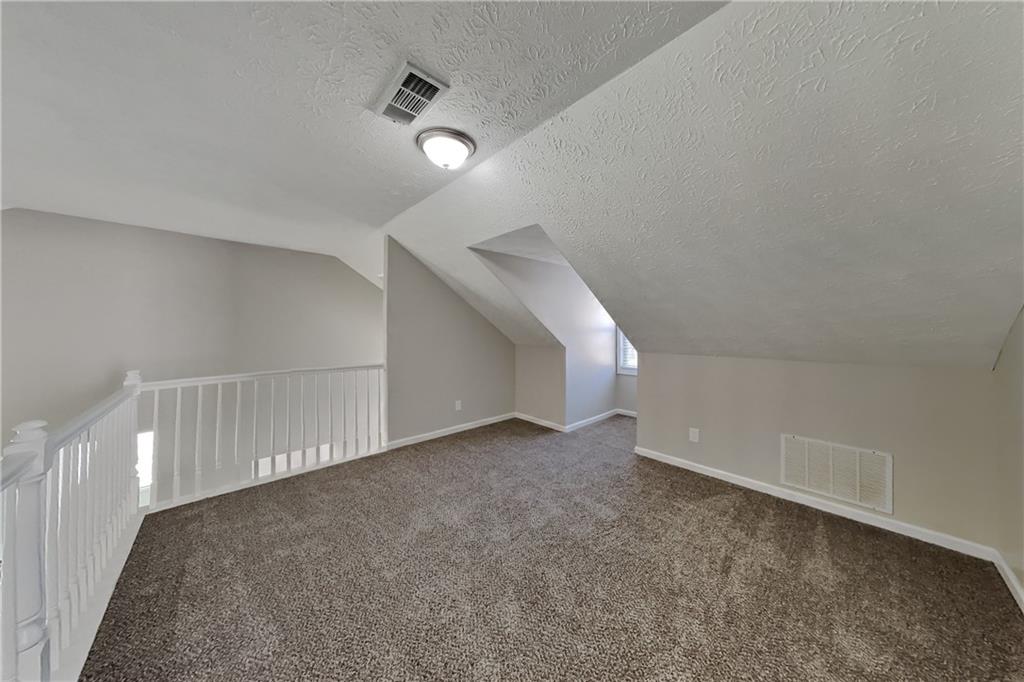 2097 Corsica Way Southwest Marietta, GA 30008 - Photo 4 of 25 a view of an empty room with stairs