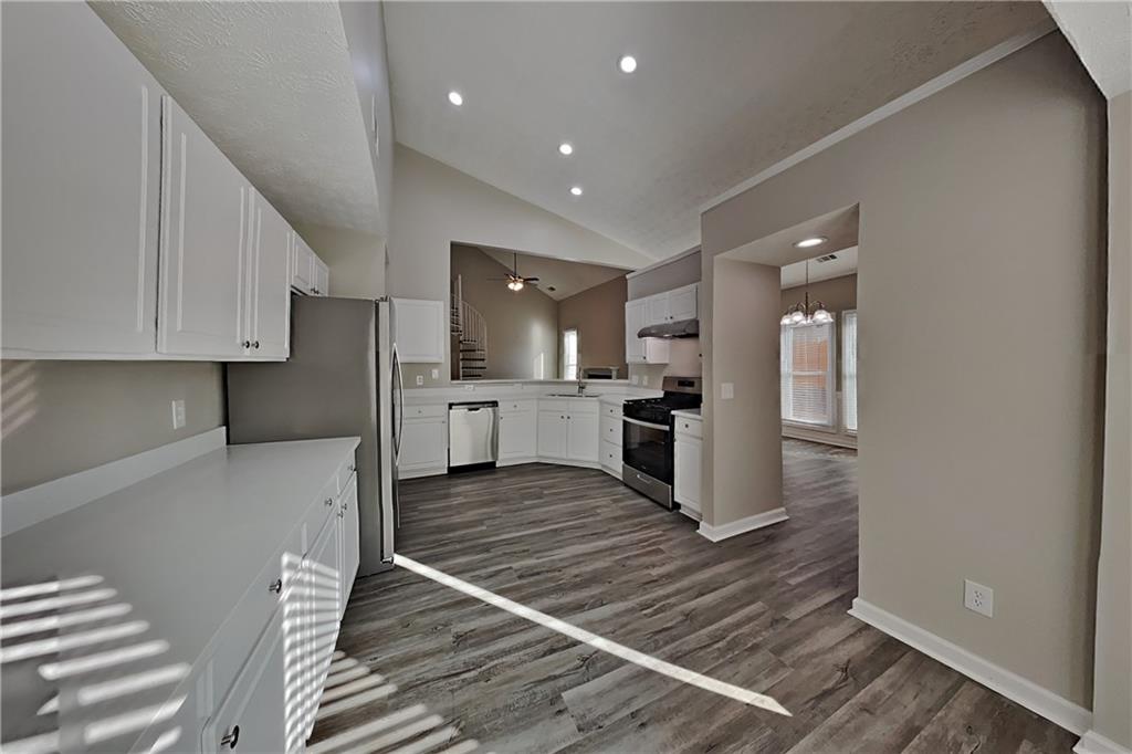 2097 Corsica Way Southwest Marietta, GA 30008 - Photo 5 of 25 a kitchen with stainless steel appliances granite countertop a refrigerator and a stove top oven
