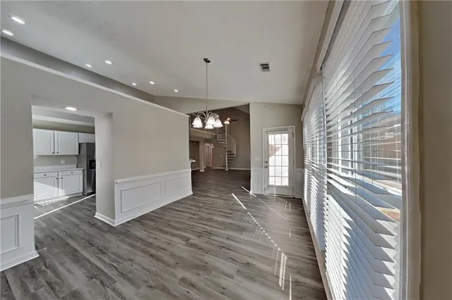 a view of hallway with a large window