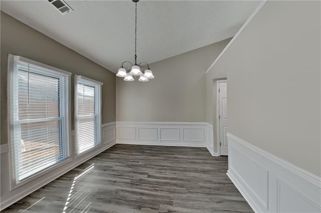 2097 Corsica Way Southwest Marietta, GA 30008 - Photo 7 of 25 a view of room with window and hardwood floor